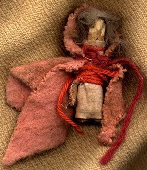 doll made from wood and scraps of cloth