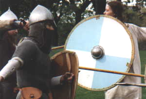 Armoured knights in combat with peasants